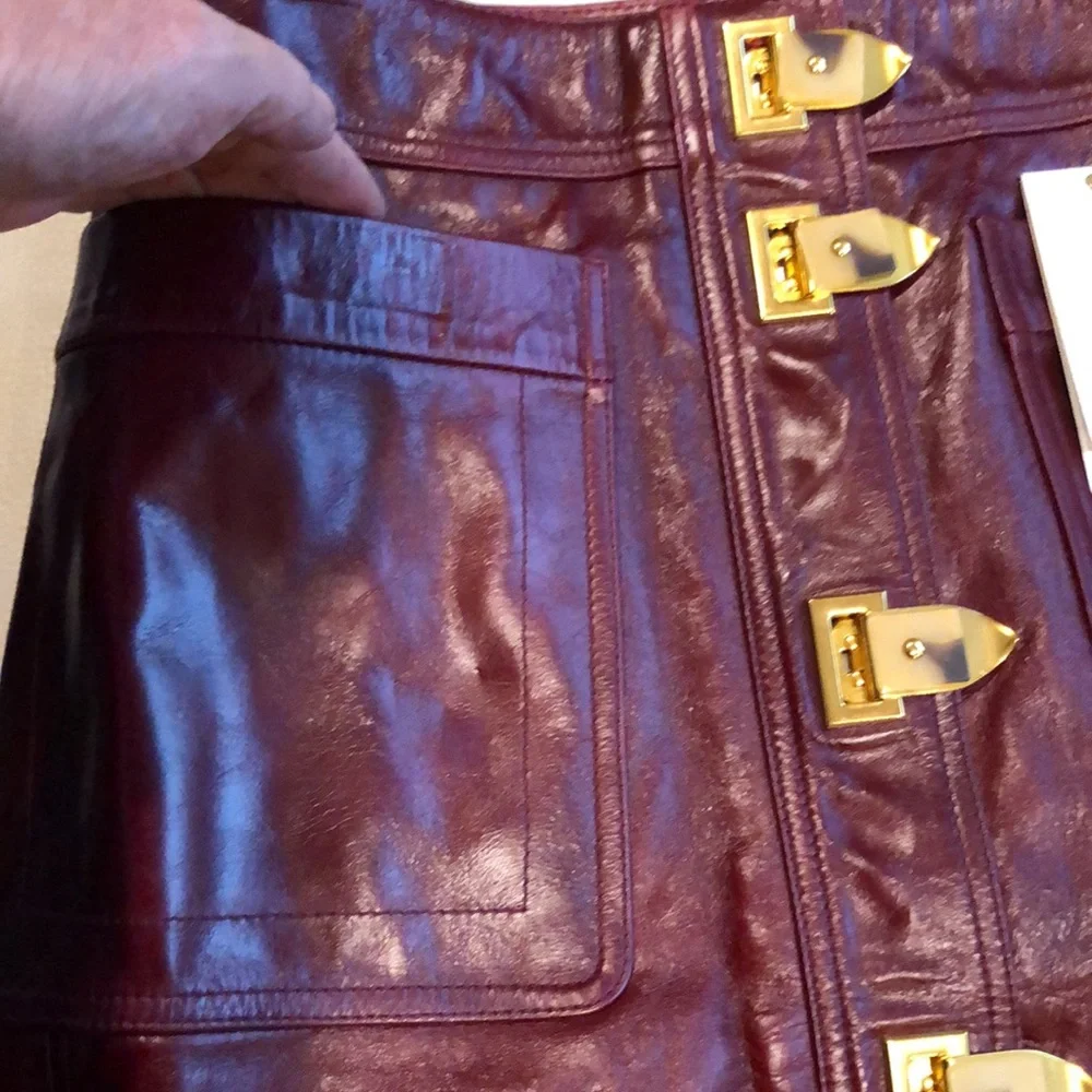 Tory Burch burgundy leather skirt with gold clasps on front - Picture 4 of 8
